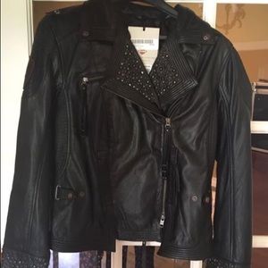 Woman’s black leather jacket